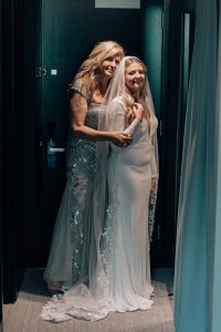 mom and bride standing
